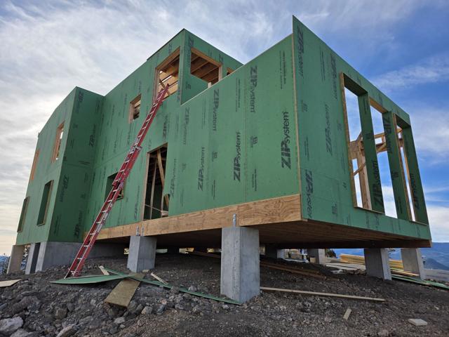 Two-story frame on concrete piers