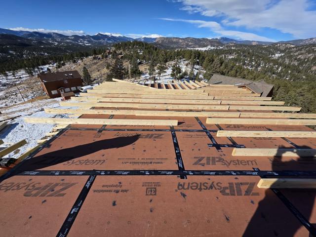 Roof framing with the valley beyond