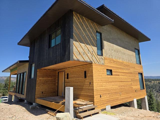 Covered entry with wood siding