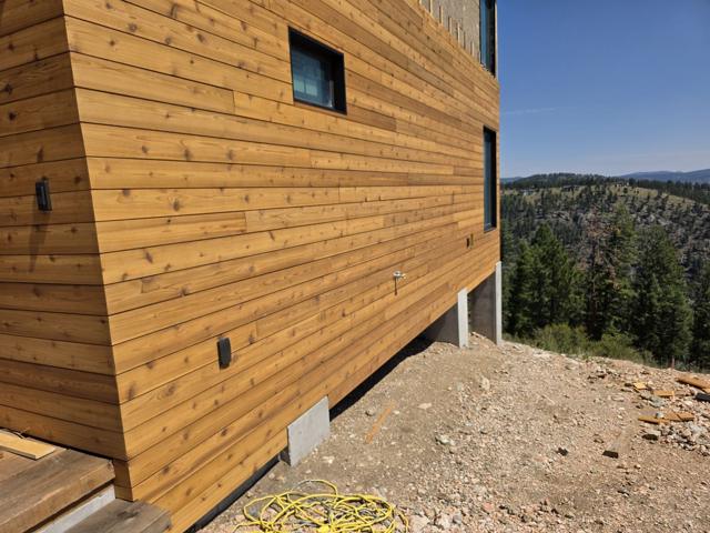Wood lap siding with the valley beyond