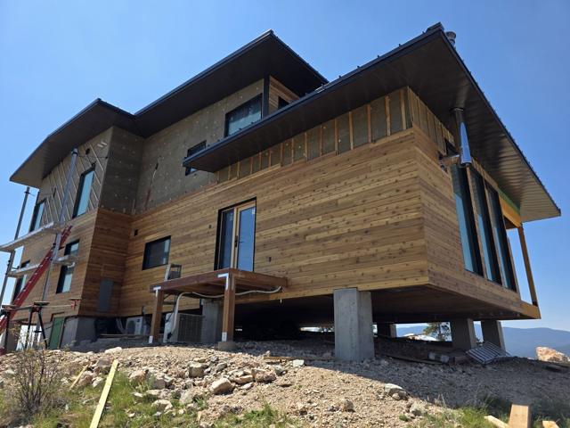 Wood siding on concrete piers