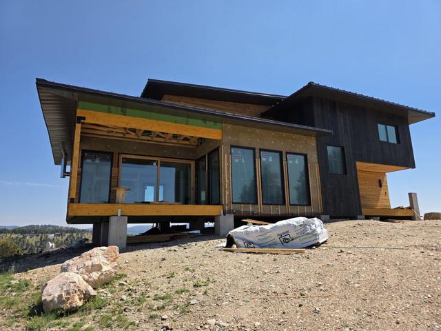 Front with window wall and deep overhangs